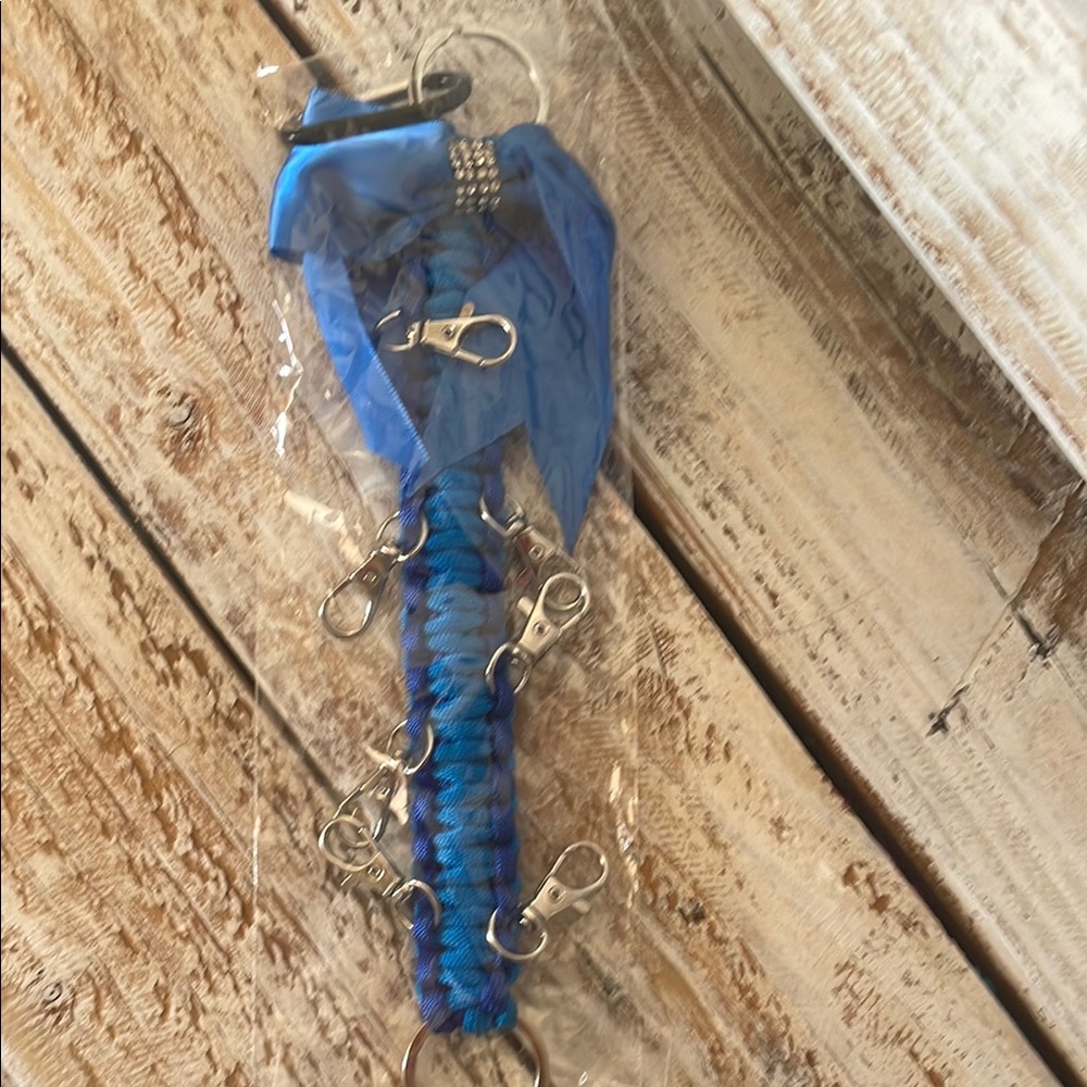 Brand New Vibrant Blue Cheerleading Keychain with Clips and Ribbon to Hold Bows.